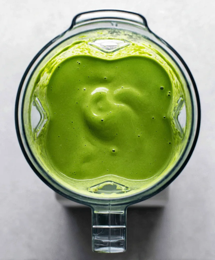 Detox Island Green Smoothie (Trusted Copycat Recipe) Detox Island Green Smoothie Detox Island Green Smoothie being blended in blender