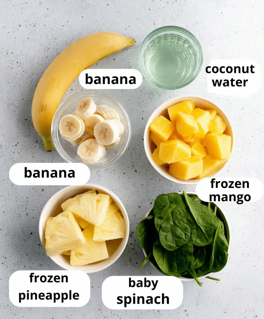Detox Island Green Smoothie (Trusted Copycat Recipe) Detox Island Green Smoothie Ingredients for Detox Island Green Smoothie laid out on counter